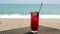 Fresh Red Berries Cocktail on Beach Table, Defocused Turquoise Sea on Background