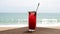 Fresh Red Berries Cocktail on Beach Table, Defocused Turquoise Sea on Background