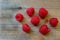 Fresh red berries Raspberry European on a wooden surface