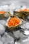 Fresh red caviar in the three oyster shells on ice