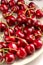 Fresh red cherries close up, on neutral background. Summer delicious fruit.