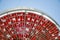 Fresh red cherry on a sieve against the blue sky