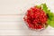 Fresh red currants in bowl on wooden table close up.Ripe large organic red currant .Summer fresh berries. Harvest time