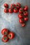 Fresh red delicious tomatoes on an old wooden tabletop backgro