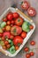 Fresh red and green tomatoes in a basket