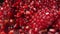 Fresh red juice is flowing down the ripe pomegranate grains