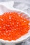 Fresh red  salmon caviar. served  around ice. macro shot.  Protein luxury delicacy  healthy food