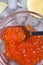 Fresh red  salmon caviar with spoon and  lime around ice. macro shot.  Protein luxury delicacy  healthy food. flat lay