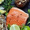 Fresh red salmon trout fish steak with fresh oysters, herbs, lemon and lime. Raw fresh seafood flatlÐ°y, citrus and spices