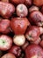 Fresh red shiny apples on the counter