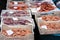 Fresh red shrimps prawns and calamary for sale in the fish market of Catania, Sicily, Italy