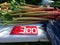 Fresh rhubarb for sale at a farm stand with price