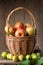 Fresh ripe apples in basket on rustic table