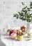 Fresh ripe apples on the kitchen table on a light background. Cozy home concept