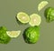 Fresh ripe bergamot fruits falling on pale green background