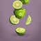 Fresh ripe bergamot fruits falling on pale purple background