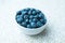 Fresh ripe blueberries in a bowl, vintage look