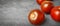 Fresh ripe brown tomatoes on table, closeup. Banner design