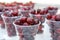 Fresh ripe cherries in a plastic Cup