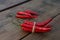 Fresh ripe chili peppers on wooden table