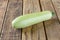 Fresh ripe delicious zucchini on wooden table