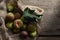 Fresh ripe figs in jute bag on wooden background. Healthy eating