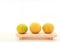 Fresh ripe green and orange tangerine citrus, mandarin oranges, fruit on wood tray on white table background. Seasonal