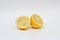 Fresh, ripe, isolated, juicy bisected lemon on a white background. Studio macro shoot
