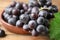 Fresh ripe juicy grapes in bowl on table