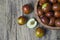 Fresh ripe jujube fruits in bowl on wooden rustic background