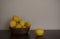 Fresh ripe lemons in wooden basket