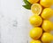 Fresh ripe lemons on wooden table