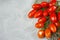 Fresh ripe mini marzano tomatoes on grey boards