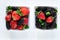 Fresh ripe mulberries and strawberries with mint in bowl on white background, copy space