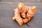 The fresh ripe orange color turmeric on the wooden background