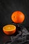 Fresh ripe orange decorated on a slate background in the kitchen