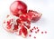 Fresh, ripe, organic pomegranate fruit on white background.