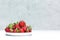 Fresh ripe organic strawberries in a white bowl. Juicy red delicious berries. Space for text. Healthy eating concept
