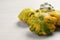Fresh ripe pattypan squashes on white wooden table, closeup. Space for text