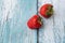 Fresh ripe perfect strawberry on blue wooden background. Fresh strawberry isolated. Natural food backdrop with red berries.