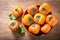 Fresh ripe persimmon fruit, top view