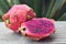 Fresh ripe Pitaya or Dragon fruit of the genus Hylocereus,Cactaceae family.Pitahaya Pitaya roja red tropical exotic fruit on old