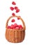 Fresh ripe raspberries falling into wicker basket on background