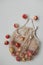 Fresh ripe red apples in a eco mesh shopping bag on a white background. Zero waste, no plastic. Autumn flatlay