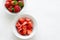 Fresh ripe strawberries in bowl on white background, copy space