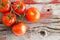 Fresh ripe tomatoes on the vine on a market shelf