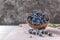 Fresh ripe wild blueberries in bowl. Wild blueberry in top view