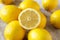 Fresh Ripe Yellow Organic Lemons on cloth, side view. Close-up