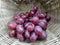 Fresh Ripen sweet grapes in bamboo basket