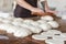 Fresh rolled dough at bakery house baking sheet pan wooden table with flour bread